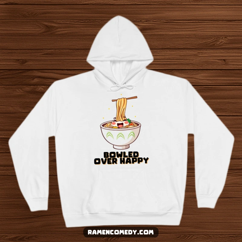 Funny Hoodie featuring a steaming ramen bowl with a smiling face energetically jumping out, symbolizing culinary happiness.